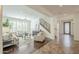 Inviting living room featuring stylish furniture, wood flooring, and plantation shutters for natural light at 4576 E Waterman St, Gilbert, AZ 85297