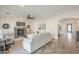Open living space includes a stone fireplace, neutral furnishings, and an entryway leading to the front door at 4576 E Waterman St, Gilbert, AZ 85297