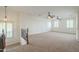 Loft with neutral carpet, white walls, and two windows for natural light at 4576 E Waterman St, Gilbert, AZ 85297