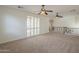 Spacious loft featuring neutral carpet, white walls, and shuttered windows at 4576 E Waterman St, Gilbert, AZ 85297