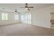 Loft featuring neutral carpet, white walls, shuttered windows, and a ceiling fan at 4576 E Waterman St, Gilbert, AZ 85297