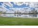Picturesque community pond and park, reflecting the blue skies and clouds at 4576 E Waterman St, Gilbert, AZ 85297