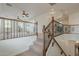 Staircase leading to an open loft with neutral carpet and decorative railings at 4576 E Waterman St, Gilbert, AZ 85297