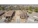 Overhead angle of a single-Gathering home featuring desert landscaping, a two-car garage, and a tile roof at 4610 S Hassett Cir, Mesa, AZ 85212