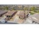 An aerial view showcases a residential neighborhood with neat landscaping and homes lining quiet streets at 4610 S Hassett Cir, Mesa, AZ 85212