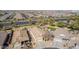 Expansive aerial view of a residential neighborhood with well-maintained homes and desert landscaping at 4610 S Hassett Cir, Mesa, AZ 85212