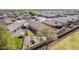 An aerial view features a well-maintained backyard with a pool, patio area, and lush landscaping at 4610 S Hassett Cir, Mesa, AZ 85212