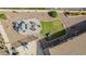 Aerial view of a landscaped backyard with a dining table and a section of green grass at 4610 S Hassett Cir, Mesa, AZ 85212