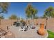 Cozy backyard patio with comfortable seating and attractive landscaping at 4610 S Hassett Cir, Mesa, AZ 85212