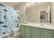 bathroom featuring a shower and vanity at 4610 S Hassett Cir, Mesa, AZ 85212