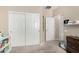 Comfortable bedroom with built-in storage and adjacent bathroom with growth chart at 4610 S Hassett Cir, Mesa, AZ 85212