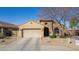 Charming single-story home with a neutral color palette, low maintenance desert landscaping, and two-car garage at 4610 S Hassett Cir, Mesa, AZ 85212