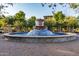 Elaborate fountain feature adds beauty to the outdoor landscape at 4610 S Hassett Cir, Mesa, AZ 85212