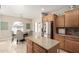 Bright kitchen featuring stainless steel appliances, granite countertops, and a kitchen island at 4610 S Hassett Cir, Mesa, AZ 85212