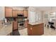 Well-equipped kitchen with granite countertops, stainless steel appliances, and custom wood cabinets at 4610 S Hassett Cir, Mesa, AZ 85212