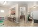 Open living space with bar seating and views of the kitchen, entryway, and dining room at 4610 S Hassett Cir, Mesa, AZ 85212
