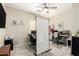 Home office space with multiple workstations, neutral walls, and good lighting for productivity at 4610 S Hassett Cir, Mesa, AZ 85212