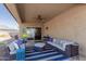 Inviting covered patio with stylish furniture, perfect for outdoor relaxation and entertainment at 4610 S Hassett Cir, Mesa, AZ 85212