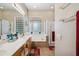 A primary bathroom with double sinks, garden tub, and a glass block window at 4829 E Charleston Ave, Scottsdale, AZ 85254