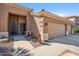 Inviting front exterior with desert landscaping, showcasing the three car garage and secure front entryway at 4829 E Charleston Ave, Scottsdale, AZ 85254