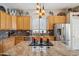 Modern kitchen island with granite countertops, stainless steel appliances, and decorative accents at 4829 E Charleston Ave, Scottsdale, AZ 85254