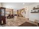 Spacious open concept living area, flowing from dining space to cozy seating with a stone fireplace at 4829 E Charleston Ave, Scottsdale, AZ 85254