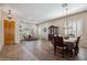 Spacious living area featuring a formal dining setup and large windows providing natural light at 4829 E Charleston Ave, Scottsdale, AZ 85254