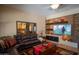 Comfortable living room with oversized mirror, floating shelves, and view to kitchen at 4829 E Charleston Ave, Scottsdale, AZ 85254