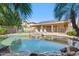 Enjoy the backyard swimming pool area with lounge chairs and well maintained landscaping at 4829 E Charleston Ave, Scottsdale, AZ 85254