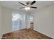 Spacious bedroom boasting modern ceiling fan, wood floors, and an airy ambiance at 5303 N 7Th St # 134, Phoenix, AZ 85014