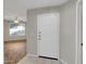 Apartment entryway featuring a white door with view to a living space at 5303 N 7Th St # 134, Phoenix, AZ 85014