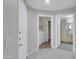 Hallway with doors to laundry room and bathroom; tile floors at 5303 N 7Th St # 134, Phoenix, AZ 85014