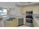 A kitchen featuring stainless steel appliances, light wood cabinets, and an open concept design at 5303 N 7Th St # 134, Phoenix, AZ 85014