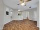 Open-concept living room and kitchen area featuring wood floors at 5303 N 7Th St # 134, Phoenix, AZ 85014