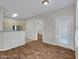 Bright living room with wood floors and a view into the kitchen and dining area at 5303 N 7Th St # 134, Phoenix, AZ 85014