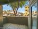 Relaxing patio space with lush tree views and a glimpse of covered parking at 5303 N 7Th St # 134, Phoenix, AZ 85014