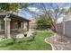 Backyard has putting green, fountain, and covered patio at 5755 W Harrison St, Chandler, AZ 85226