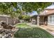 Backyard with putting green and covered patio at 5755 W Harrison St, Chandler, AZ 85226