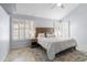 Serene bedroom showcasing a ceiling fan, neutral walls, and plantation shutters at 5755 W Harrison St, Chandler, AZ 85226