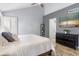 Bedroom featuring a ceiling fan, artwork, and ample natural light at 5755 W Harrison St, Chandler, AZ 85226