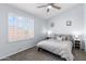 Bedroom with neutral colored walls, carpet and window with shutters at 5755 W Harrison St, Chandler, AZ 85226