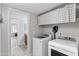 Convenient laundry room featuring modern appliances and ample storage at 5755 W Harrison St, Chandler, AZ 85226