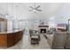 Inviting living room with a stone fireplace, cozy seating, and an adjacent kitchen area at 5755 W Harrison St, Chandler, AZ 85226