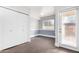 Bedroom featuring wooden flooring, a closet, a window and blue and white paint on the walls at 5808 E Brown Rd # 42, Mesa, AZ 85205