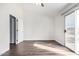 Bedroom with high ceilings and a sliding glass door to a private balcony at 5808 E Brown Rd # 42, Mesa, AZ 85205