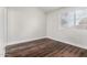 Cozy bedroom featuring hardwood flooring and a window overlooking the outside area at 5808 E Brown Rd # 42, Mesa, AZ 85205