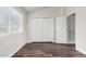 Bedroom with a double closet and white walls features a window letting in natural light at 5808 E Brown Rd # 42, Mesa, AZ 85205