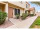 Inviting townhome entrance featuring well-kept landscaping and a cozy, welcoming atmosphere at 5808 E Brown Rd # 42, Mesa, AZ 85205