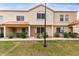 Charming two-story townhome with a traditional stucco exterior and a well-manicured front lawn at 5808 E Brown Rd # 42, Mesa, AZ 85205