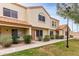 Charming two-story townhome with a traditional stucco exterior and a well-manicured front lawn at 5808 E Brown Rd # 42, Mesa, AZ 85205